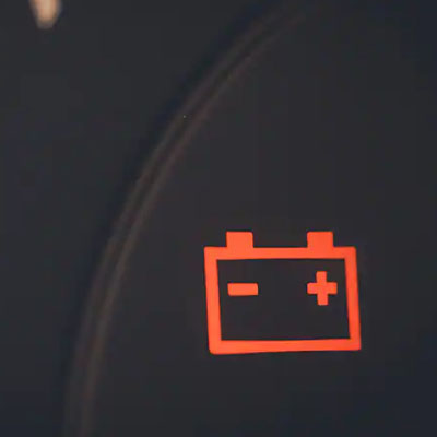 Illuminated battery warning light on dashboard